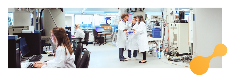 Researchers in a clinical lab setting exploring lysosomal diseases